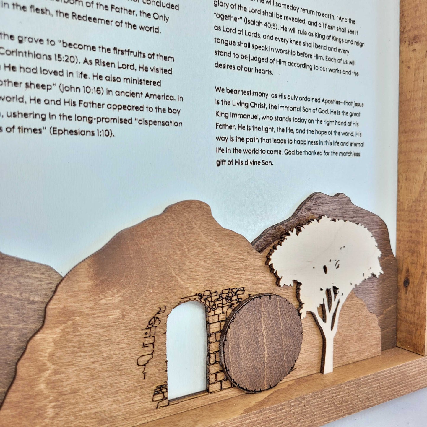 The Living Christ wooden sign with resurrection tomb scene