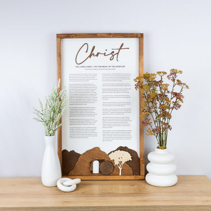 The Living Christ wooden sign with resurrection tomb scene