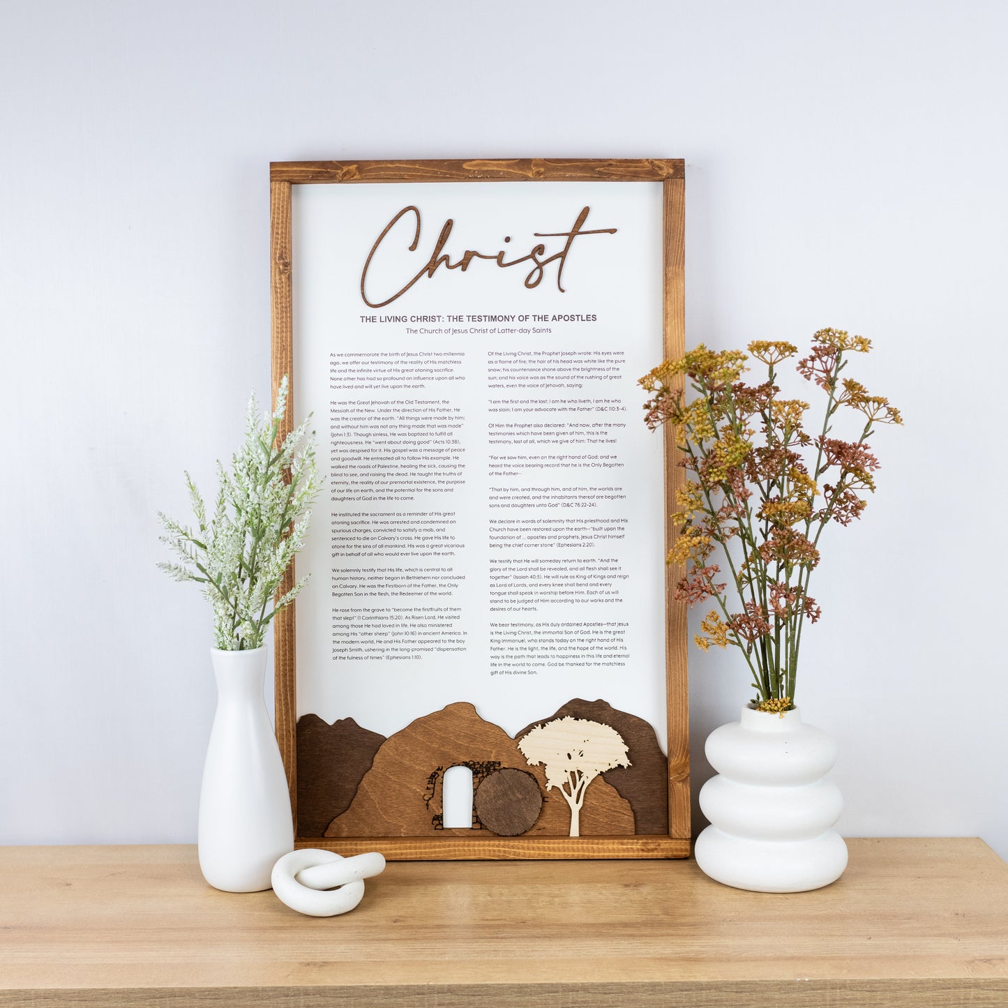 The Living Christ wooden sign with resurrection tomb scene